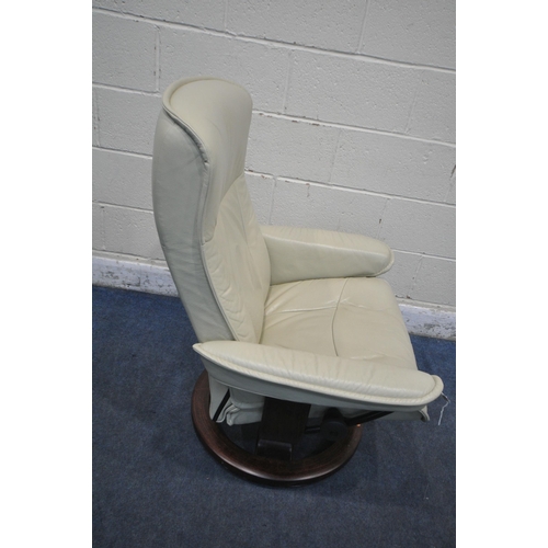 1306 - AN EKORNES STRESSLESS CREAM LEATHER RECLINING ARMCHAIR, with a matching footstool (condition report:... 