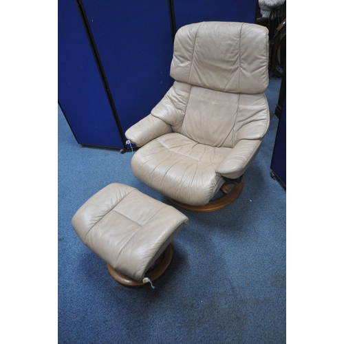 1316 - AN EKORNES STRESSLESS CARAMEL LEATHER UPHOLSTERED RECLINING ARMCHAIR, along with a footstool (condit... 