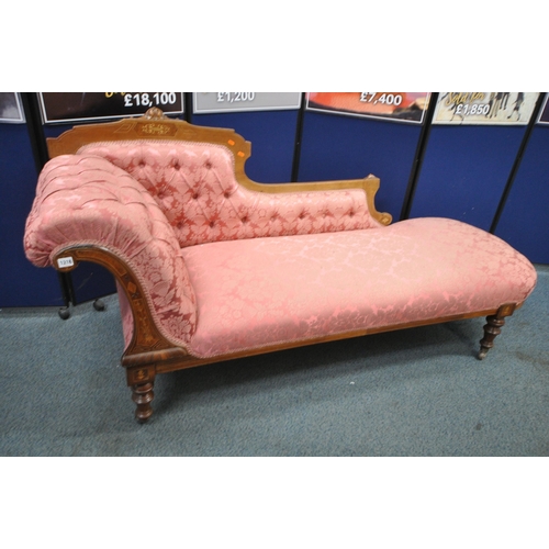 1318 - A LATE VICTORIAN WALNUT AND INLAID CHAISE LOUNGE, with pink and floral upholstery, raised on turned ... 