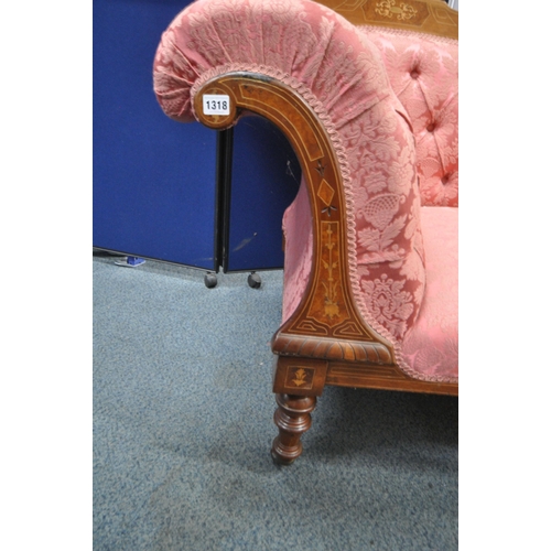 1318 - A LATE VICTORIAN WALNUT AND INLAID CHAISE LOUNGE, with pink and floral upholstery, raised on turned ... 