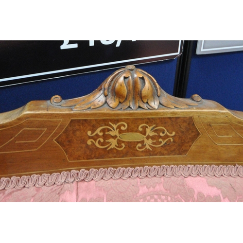 1318 - A LATE VICTORIAN WALNUT AND INLAID CHAISE LOUNGE, with pink and floral upholstery, raised on turned ... 