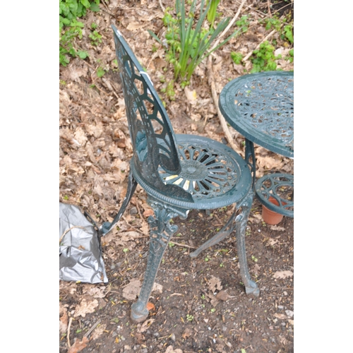 1005 - A GREEN PAINTED CAST ALUMINIUM GARDEN TABLE 60cm in diameter with a pair of similar chairs (conditio... 