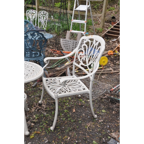 1008 - A CAST ALUMINIUM GARDEN TABLE 61cm in diameter,  two matching chairs and parasol base (4)