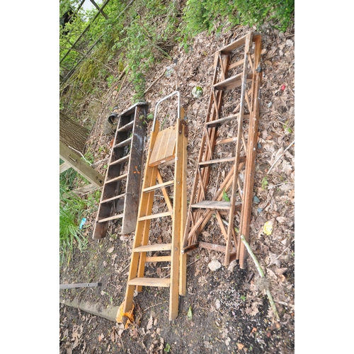 1010 - THREE VINTAGE WOODEN STEP LADDERS including one with lattice sides 145cm high (3)