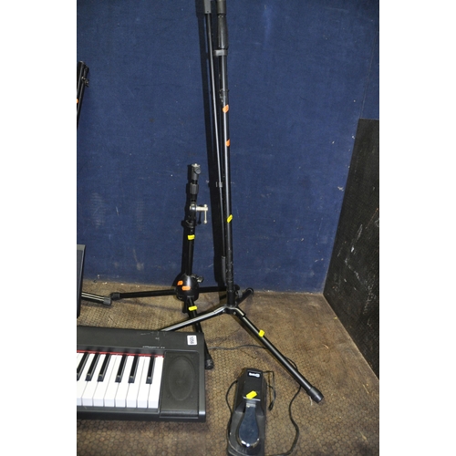 1056 - A YAMAHA PIAGGERO NP-32 ELECTRONIC PIANO with Rock Jam Sustain pedal, keyboard stand, instrument sta... 