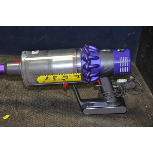 1057 - A DYSON V10 ANIMAL CORDLESS VACUUM CLEANER with power supply (PAT pass and working) (condition repor... 