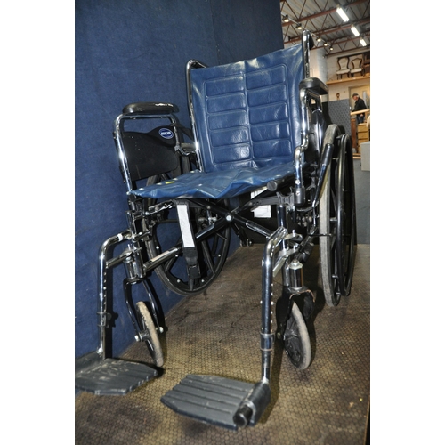 1058 - AN INVACARE TRACER EX2 FOLDING WHEELCHAIR with two footrests