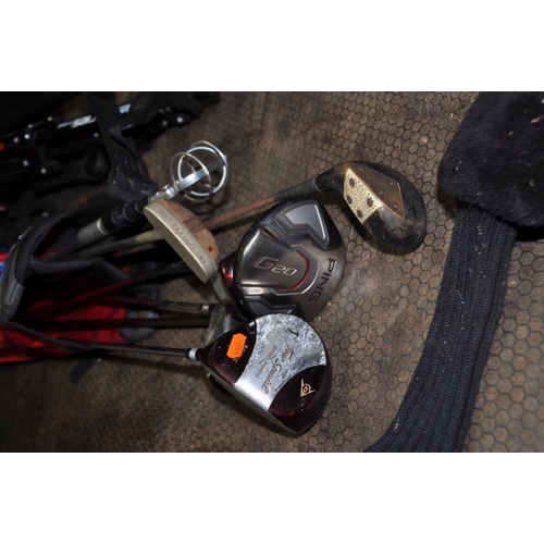 1079 - A PING VINYL GOLF BAG, A PING G20 DRIVER and Dunlop drivers, a Mizuna trolley and two putters