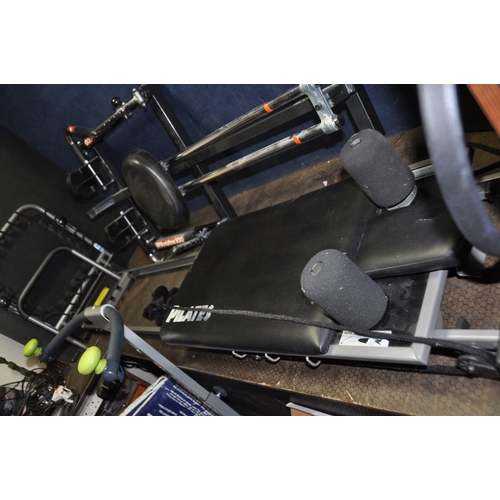 1080 - A COLLECTION OF EXERCISE EQUIPMENT including a DP Bodytone 300 rowing machine, an Aero Pilates machi... 