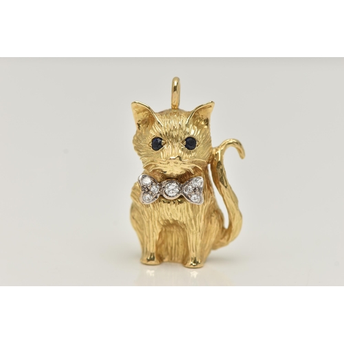 11 - AN 18CT GOLD DIAMOND AND SAPPHIRE CAT PENDANT, the seated cat with sapphire eyes and a bow set with ... 