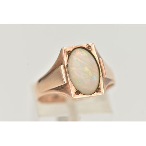 25 - A YELLOW METAL OPAL RING, set with an oval cut white opal cabochon, measuring approximately length 1... 