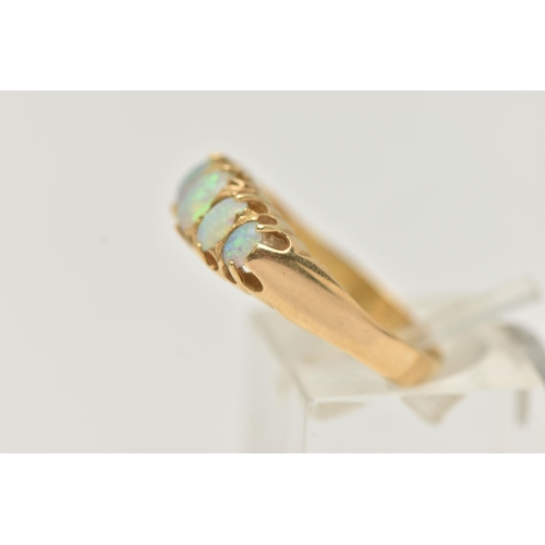 26 - AN EARLY 20TH CENTURY, 18CT GOLD OPAL FIVE STONE RING, set with five graduated oval cut, opal caboch... 