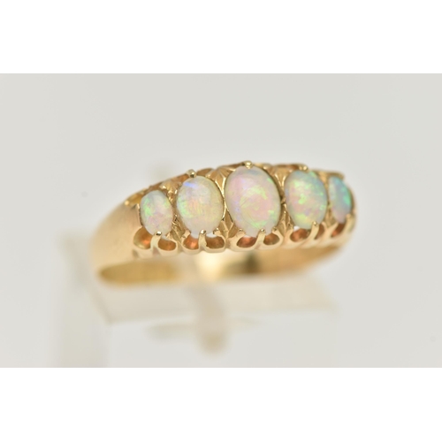 26 - AN EARLY 20TH CENTURY, 18CT GOLD OPAL FIVE STONE RING, set with five graduated oval cut, opal caboch... 