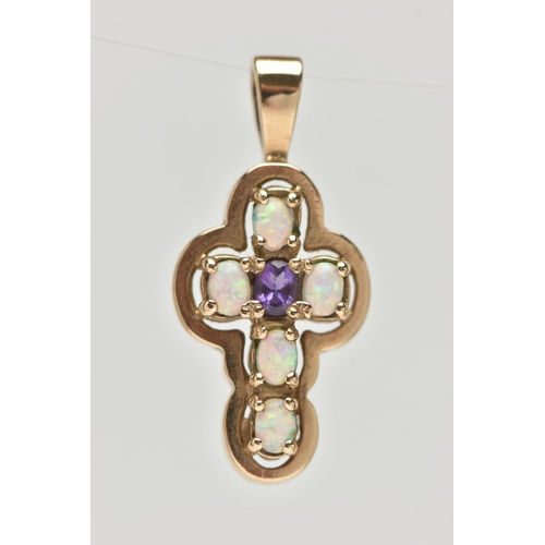 28 - A 9CT GOLD AMETHYST AND SYNTHETIC OPAL CROSS PENDANT, set centrally with an oval cut amethyst, and f... 