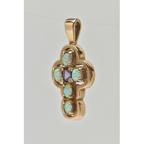 28 - A 9CT GOLD AMETHYST AND SYNTHETIC OPAL CROSS PENDANT, set centrally with an oval cut amethyst, and f... 