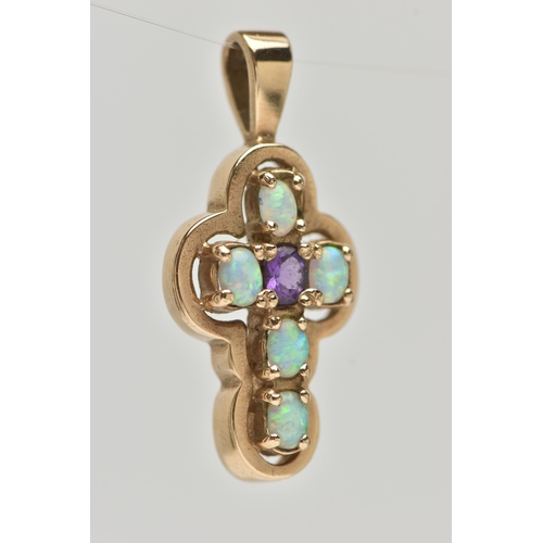 28 - A 9CT GOLD AMETHYST AND SYNTHETIC OPAL CROSS PENDANT, set centrally with an oval cut amethyst, and f... 