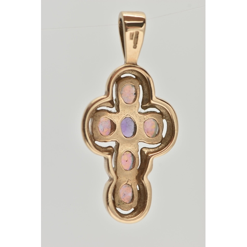 28 - A 9CT GOLD AMETHYST AND SYNTHETIC OPAL CROSS PENDANT, set centrally with an oval cut amethyst, and f... 