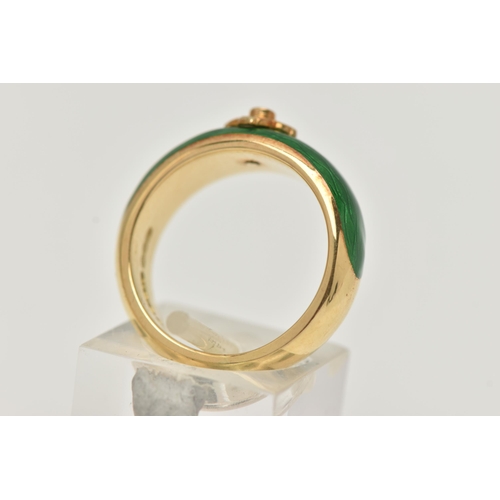 3 - AN 18CT GOLD ENAMEL AND DIAMOND RING, the tapered band with green enamel to the front, a quatrefoil ... 