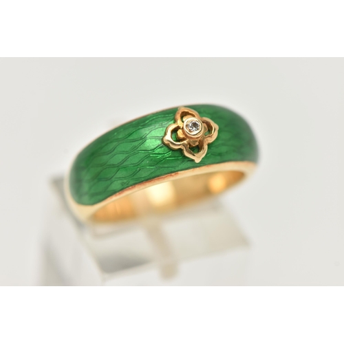 3 - AN 18CT GOLD ENAMEL AND DIAMOND RING, the tapered band with green enamel to the front, a quatrefoil ... 