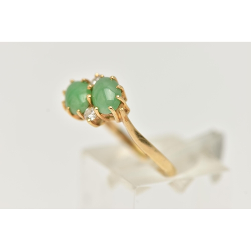 5 - AN 18CT GOLD JADE AND DIAMOND RING, of crossover  design, claw set horizontally with two oval jade c... 