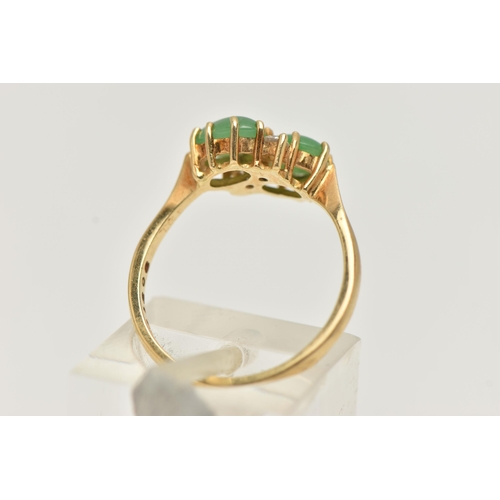 5 - AN 18CT GOLD JADE AND DIAMOND RING, of crossover  design, claw set horizontally with two oval jade c... 