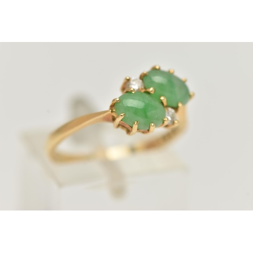 5 - AN 18CT GOLD JADE AND DIAMOND RING, of crossover  design, claw set horizontally with two oval jade c... 