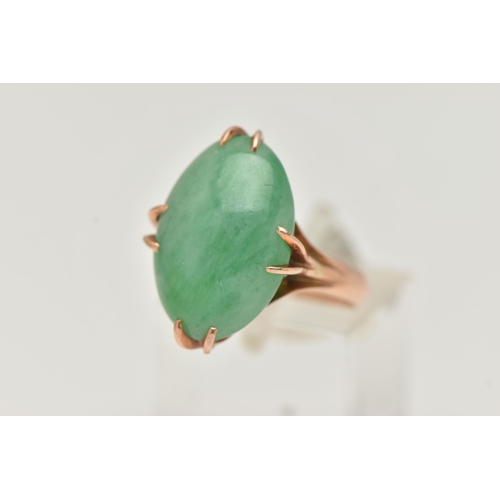 6 - A CHINESE JADE CABOCHON RING, designed as an oval jade cabochon within an eight claw setting to the ... 