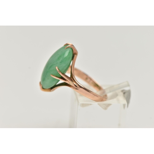 6 - A CHINESE JADE CABOCHON RING, designed as an oval jade cabochon within an eight claw setting to the ... 