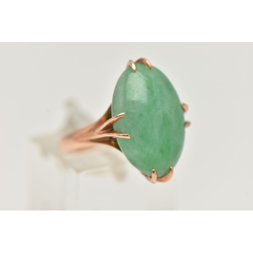 6 - A CHINESE JADE CABOCHON RING, designed as an oval jade cabochon within an eight claw setting to the ... 