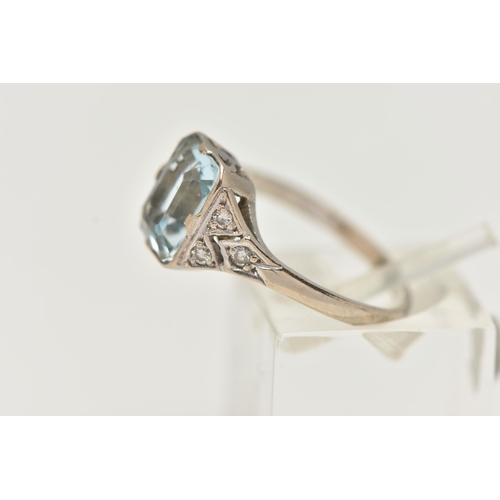 63 - AN AQUAMARINE AND DIAMOND RING, principally set with a rectangular cut aquamarine, approximate lengt... 