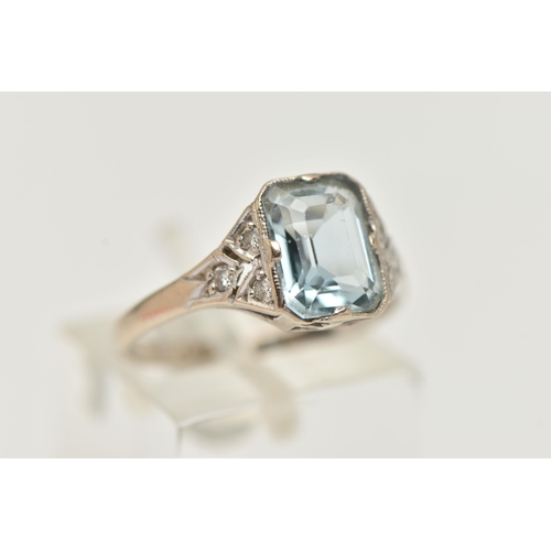 63 - AN AQUAMARINE AND DIAMOND RING, principally set with a rectangular cut aquamarine, approximate lengt... 