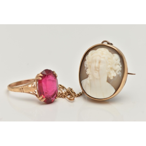 64 - A YELLOW METAL GEM SET RING AND A HIGH RELIEF CAMEO BROOCH, the yellow metal ring, set with an oval ... 