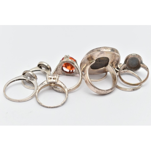 66 - EIGHT WHITE METAL RINGS, various designs, some set with semi-precious gemstones or paste, including ... 