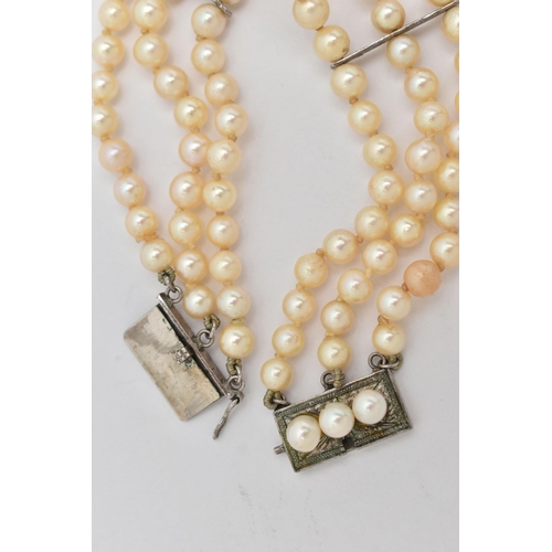 69 - A CULTURED PEARL BRACELET, three rows of cultured cream pearls with a pink hue, each measuring betwe... 