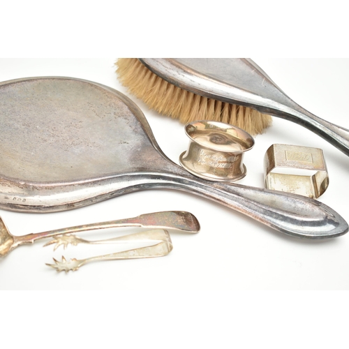 111 - A SMALL ASSORTMENT OF SILVER, to include a hand held mirror and hair brush, hallmark rubbed Birmingh... 