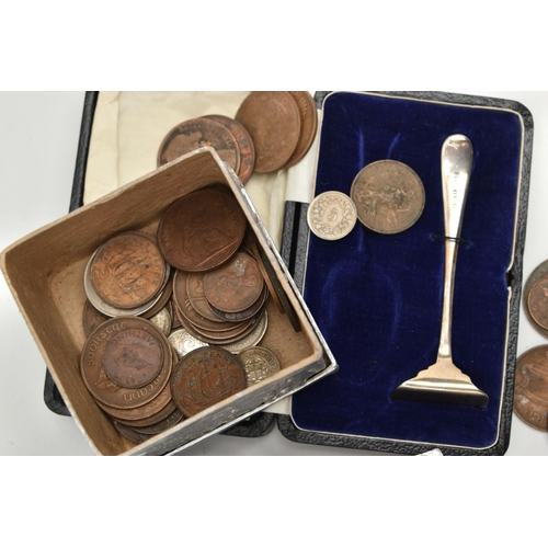 113 - A SILVER BABY FOOD PUSHER AND ASSORTED COINS, a monogramed box for a christening set, encasing a sin... 