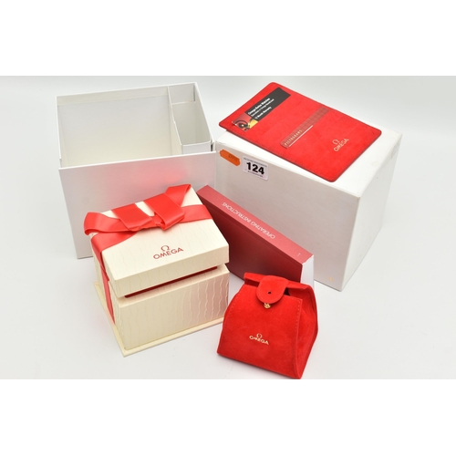 124 - AN 'OMEGA' WATCH BOX, textured box with red ribbon detail, travel pouch interior, also including a c... 