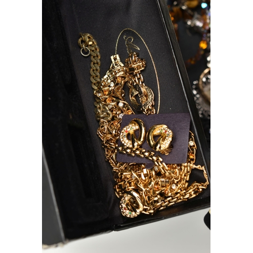 128 - A STORAGE BOX WITH COSTUME JEWELLERY, to include a boxed 'Monet' gold tone and paste set necklace wi... 