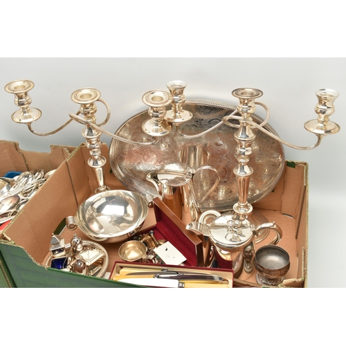 138 - TWO BOXES OF MAINLY SILVER PLATED WARE, to include a pair of candelabras, an oval tray, a condiment ... 