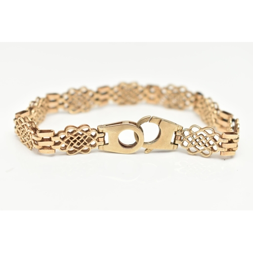 87 - A 9CT GOLD FANCY LINK BRACELET, open work links interspaced with three bar links, fitted with a larg... 