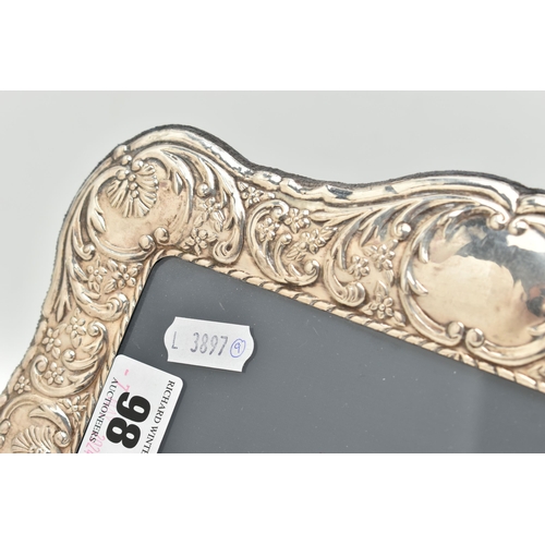 98 - A SILVER FRONTED PICTURE FRAME, rectangular form frame, with embossed floral and foliage detail, app... 