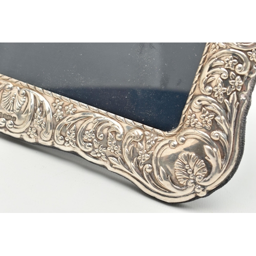 98 - A SILVER FRONTED PICTURE FRAME, rectangular form frame, with embossed floral and foliage detail, app... 