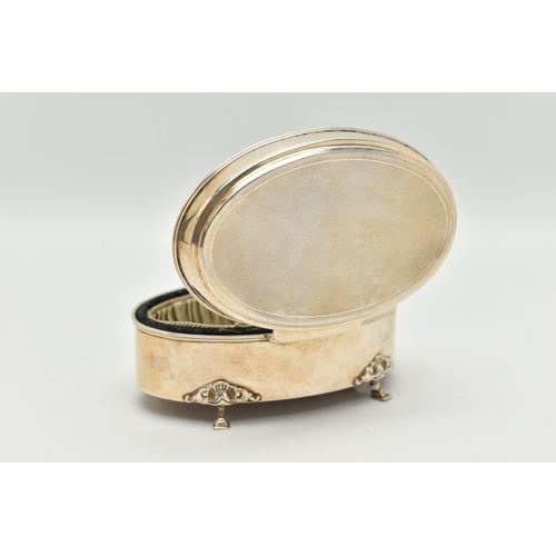 99 - AN EARLY 20TH CENTURY SILVER TRINKET BOX, of an oval form, engine turned pattern to the hinged cover... 