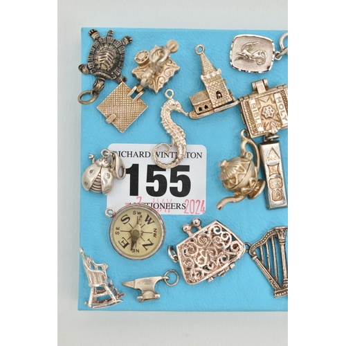 155 - ASSORTED SILVER AND WHITE METAL CHARMS, to include a silver ingot, hallmarked Birmingham, approximat... 