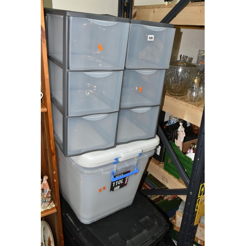 335 - A GROUP OF PLASTIC STORAGE BOXES, comprising two heavy duty trunks 145L, two 'Mega 110L storage boxe... 