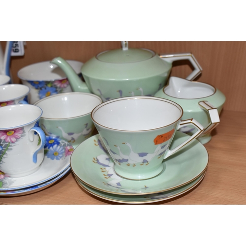 359 - A SHELLEY COFFEE SET, pattern number 12216, decorated with a blue and pink floral design on a white ... 