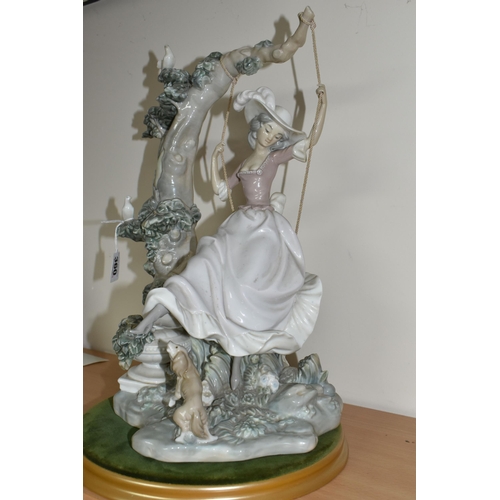 360 - A LLADRO 'SWINGING' SCULPTURE OF A GIRL ON A SWING, model no 1297, sculptor Salvador Debon, issued 1... 