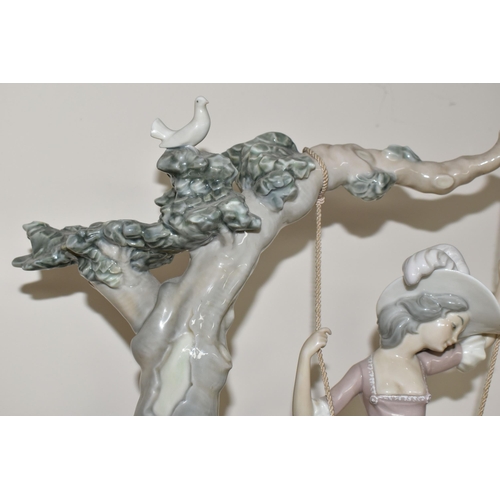 360 - A LLADRO 'SWINGING' SCULPTURE OF A GIRL ON A SWING, model no 1297, sculptor Salvador Debon, issued 1... 