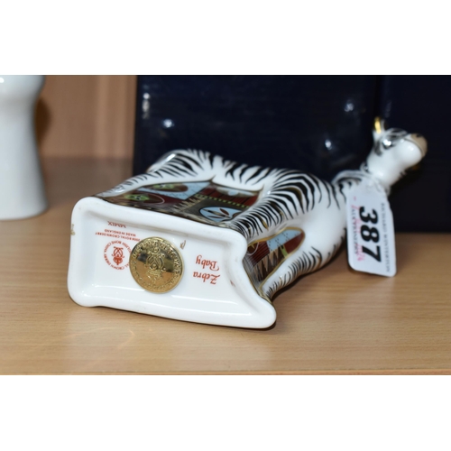 387 - A BOXED ROYAL CROWN DERBY 'ZEBRA BABY' PAPERWEIGHT, with gold stopper, red printed backstamp and dat... 