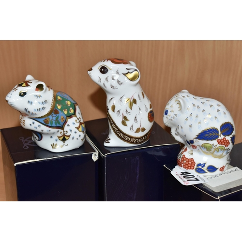 407 - THREE BOXED ROYAL CROWN DERBY PAPERWEIGHTS, comprising Royal Crown Derby Collectors Guild 'Derby Dor... 